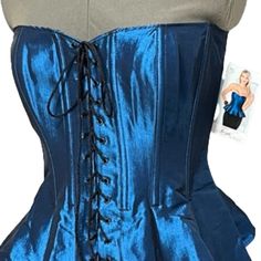 Tesa Classic By Escant Jewel Tone Sapphire Blue Corset/Bustier With Peplum Features Front Lace-Up To Customize Fit And Lift. A Zipper In The Back Allows For Easy On And Off. Size: 36 Measurement: - Armpit To Armpit (Flat) ~18.0" - Length: (Center To Hem) ~14.0"; (Armpit To Hem) ~13.0" Material: 55% Polyester, 40% Nylon, 5% Elastic Appearance: Excellent Condition, Never Worn, Nwt Blue Corset With Boned Bodice, Blue Fitted Corset For Costume Party, Blue Sleeveless Evening Corset, Evening Blue Corset With Boned Bodice, Blue Sleeveless Fitted Bodice Corset, Fitted Sleeveless Blue Corset, Sleeveless Blue Corset With Fitted Bodice, Blue Overbust Corset With Boned Bodice, Blue Overbust Corset For Costume Party