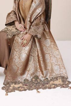 Luxury Bronze Shade Embroidered Pakistani Salwar Kameez Dupatta Suit Crafted with intricate dori work and hand-worked with a delicate tapestry of stones. Embroidered Tissue Silk Kurta For Eid, Gold Art Silk Sherwani With Chikankari Embroidery, Resham Embroidered Lawn Suit For Eid Ceremonies, Eid Anarkali With Intricate Embroidery, Traditional Long Sleeve Tissue Silk Anarkali Set, Traditional Tissue Silk Kurta With Dabka, Eid Embroidered Silk Sherwani, Eid Anarkali Set For Traditional Ceremonies, Eid Brocade Sherwani With Chikankari Embroidery