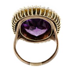 Absolutely beautiful antique impressive size amethyst pearl and 14kt yellow gold ring centrally set with one large oval shaped faceted deep vibrant purple amethyst measuring approximately 19 x 14 x 9.5mm depth with an approximate weight of 13.40 cts. surrounded by a gold wirework filigree intricate frame further accented with numerous small peg set pearls - substantial 14kt yellow gold ring mount - very good condition - hard to approximate size but somewhere around a size 7.5 - 8 can be sized - Fine Jewelry Purple Amethyst Cabochon Ring, Purple Amethyst Cabochon Ring Fine Jewelry, Purple Cabochon Amethyst Wedding Ring, Antique Oval Amethyst Ring, Antique Oval Purple Amethyst Ring, Victorian Oval Pearl Ring With Gemstone, Oval Purple Amethyst Ring With 17 Jewels, Victorian Style Oval Purple Amethyst Ring, Victorian Style Purple Oval Amethyst Ring