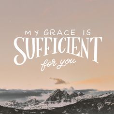 the words, my grace is sufficient for you are overlaid by mountains and clouds