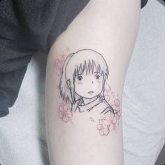 a woman's arm with a drawing of a girl and flowers on the side