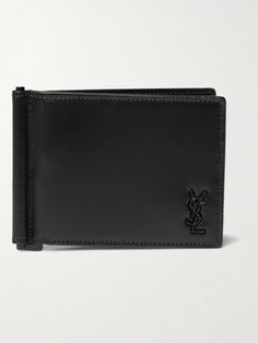 Neat and streamlined, SAINT LAURENT's wallet slips easily into a back pocket or briefcase. It's made from smooth black leather appliquéd with the house's logo; inside, it has six handy card slots and a money clip. Luxury Modern Black Wallets, Wallet With Money, Black Luxury Wallet With Branded Hardware, Saint Laurent Collection, Luxury Black Leather Wallet On Chain, Black Ysl Wallet, High-end Black Rectangular Wallet, Saint Laurent Wallet, Billfold Wallet