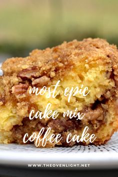 a close up of a piece of cake on a plate with the words most epic cake mix coffee cake