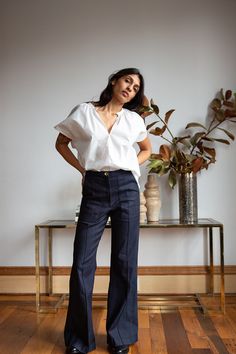 The Darby is our best-selling high-waisted, flared stretch denim pant with front patch pockets and a pintuck stitched down front of each leg. With a subtle 70's svelte silhouette, Darby fits the figure beautifully. Pairs perfectly with slouchy sweaters, fitted blazers, or a simple tee or silk camisole. Erica Tanov This garment is made of a raw denim that has been left in its pure, untreated state. To avoid dye transfer, we recommend an initial separate cold water wash and line dry, which will re Erica Tanov, Stretch Denim Pants, Slouchy Sweater, Classic Pants, Silk Camisole, Spring Sweater, Simple Tees, Dark Indigo, Raw Denim