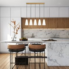 a kitchen with marble counter tops and stools