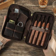 For the cigar connoisseur who demands both style and functionality, our Luxurious Leather Cigar Case is the quintessential accessory. Crafted from supple, high-quality leather, this case promises to keep your prized cigars in pristine condition while on the go.   Sophisticated Features:     Secure Storage:  The case is designed with individual slots to hold each cigar, ensuring they remain in optimal condition.   Accessory Accommodation:  Equipped with pockets for a cutter and lighter, this case is a self-contained unit for your cigar enjoyment.   Elegant Design:  The sleek exterior opens to a practical and organized interior, making it an accessory that looks as good as it functions.    Ideal For:     On-the-Go Indulgence:  Compact and robust, it fits effortlessly into a briefcase or trav Travel Humidor, Humidor, Crazy Horse, Leather Travel, Jewelry Packaging, Travel Case, Groomsman Gifts, Cigars, Italian Leather