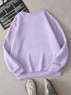 Stay cozy and stylish all winter long with our Slogan Graphic Thermal Lined Sweatshirt. The thermal lining will keep you warm, while the stylish slogan graphic adds a touch of personality to your look. Perfect for any casual occasion, this sweatshirt is a must-have for your wardrobe. Color : Lilac Purple Style : Casual Pattern Type : Graphic Pattern Type : Slogan Type : Pullovers Neckline : Round Neck Sleeve Length : Long Sleeve Sleeve Type : Drop Shoulder Length : Regular Fit Type : Regular Fit Casual Solid Color Crew Neck Hoodie, Casual Hoodie With Crew Neck, Trendy Purple Sweatshirt With Ribbed Cuffs, Trendy Crew Neck Sweatshirt In Solid Color, Winter Fleece Sweater With Letter Print, Comfortable Winter Crew Sweatshirt, Trendy Purple Winter Sweatshirt, Trendy Purple Sweatshirt For Winter, Casual Purple Winter Sweatshirt