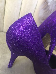 Royal purple covers the entire top portion of the heels while the underside is covered in an ultra-fine yellow gold glitter. These heels can be made in any color combo desired. If you would like another color combination please leave your color choices at checkout. This heel is available in additional colors and shoe styles. Contact us today for more color and style options. All heels are handmade and shipped out within 1-2 weeks of the purchase date. We always welcome new designs and love to wo Tall Heels, Heels Purple, Heels Short, Glitter High Heels, Short Heels, Costume Shoes, Purple And Yellow, Gold Heels, Royal Purple