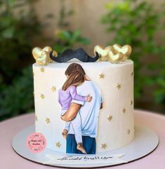 a cake decorated with an image of a couple hugging