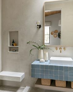 a bathroom with a blue counter and white sink