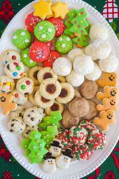 a white plate topped with lots of different types of cookies