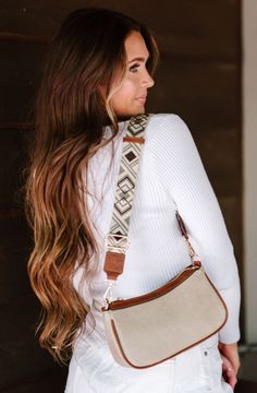 Meet the Scout Crossbody—a timeless saddle bag that offers luxurious vegan leather construction and a unique woven strap. This season's take on elevated equestrian style also features contrasting trim and gold hardware for a sophisticated aesthetic, as well as a back zippered pocket and two interior pockets for easy organization. Details: 9.5" long x 5" height x 3" wide The strap adjusts from 30" - 43" end to end; 1.75" wide Back zippered pocket: 6" long x 2" wide Zippered main closure 1 interio Saddle Brown, Easy Organization, Boutique Brands, Timeless Accessories, Modern Chic, Equestrian Style, Gold Hardware, Belt Bag, Saddle Bags