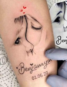 a woman's arm with a tattoo on it and the words besannyu written