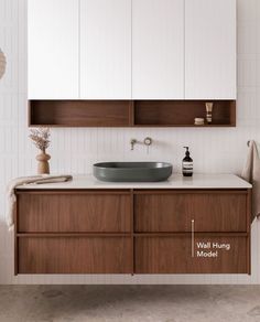 a bathroom with a sink and cabinets in it