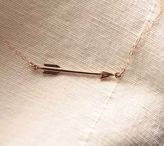 "Dainty Gold Arrow Necklace♥ The most tiny & dainty everyday necklace. Featuring a very dainty bronze arrow (38x4mm, approx 1.5\" in length) that floats amongst the most delicate & shimmering 14k gold fill chain. A gorgeous necklace that you will reach for everyday.. Necklace measure 18 inches as pictured, length can be customized. Completed with a round spring clasp. Also available in sterling silver! ❤Would you like to add an initial charm to this necklace? https://www.etsy.com/listing Dainty Necklace Gold, Jewelry Necklace Simple, Arrow Jewelry, Gold Arrow, Silver Arrow, Arrow Pendant, Jewellery Ideas, Necklace Simple, Pretty Necklaces