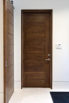 an open door in a room with white walls