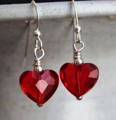 Red Swarovski crystal heart earrings. Also included in this pair of earrings are sterling silver ear wires, sterling silver beads, and sterling silver findings. Perfect for Valentine's Day, your Anniversary, or just to say I love you. :) These earrings measure about inches. @)--;----- Diy Red Earrings, Valentines Day Jewelry, Valentine Earrings, Silver Anniversary Gifts, Red Heart Earrings, Crystal Heart Earrings, Swarovski Heart, Swarovski Crystal Hearts, Valentines Earrings