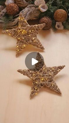 two wooden star ornaments sitting on top of a table