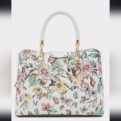 Gorgeous Spring Bag. By Aldo. Never Worn, Still In Plastic Wrap. Sold Out In Stores And Online. Colorful Florals And Butterflies. White Rope Handle With Gold Zipper Closure. Three Interior Compartments. Luxury Floral Print Top Handle Bag, Leather Top Handle Bag With Floral Print, White Tote Bag With Handle Drop, Luxury White Bags With Floral Print, Trendy White Satchel With Gold-tone Hardware, Elegant Leather Shoulder Bag With Floral Print, Chic White Satchel With Handles, Elegant Floral Print Crossbody Shoulder Bag, Feminine White Shoulder Bag With Top Handle