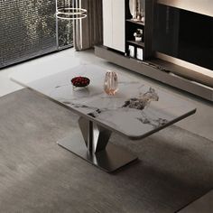 a glass table with marble top in front of a wall mounted microwave and window sill