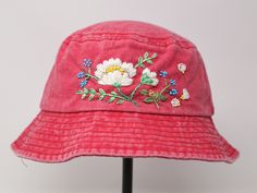 Item: flower embroidered bucket hat Material: 100% cotton Size: one size fits most Color: white, message me if you want to customize the pattern to another color Free first class shipping, upgradable priority mail service. 30 days return policy, feel confident at your purchase! Pink Cotton Cap Sun Hat, Pink Cotton Cap-shaped Sun Hat, Adjustable Pink Cotton Bucket Hat, Pink Cotton Bucket Hat With Curved Brim, Pink Cotton Bucket Hat For Spring, Casual Cotton Sun Hat With Embroidery, Casual Spring Bucket Hat With Embroidered Logo, Casual Embroidered Adjustable Bucket Hat, Casual Embroidered Cotton Bucket Hat