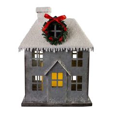 a house with a wreath on top of it