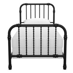 a black metal bed frame with white sheets and pillows on it, against a white background