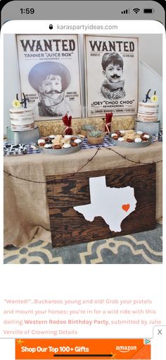 a table topped with lots of cakes and cupcakes on top of a wooden box