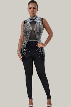 Experience exquisite luxury with the Mara Studded Mesh Sleeveless Jumpsuit. Featuring contrasting mesh and dazzling rhinestone details, the sheer sleeves add a touch of sophistication. This long, sleeveless jumpsuit boasts a regular fit and high waistline, made from a slight stretch polyester material. Be enchantingly elegant in this semi-sheer masterpiece. 88% Polyester, 12% Elastane Model is wearing size small Please allow 3-5 business days to process and ship. in cm : Size US Length Inseam Bu Sheer Sleeveless Bodysuit For Evening, Sleeveless Embellished Jumpsuits And Rompers For Night Out, Embellished Sleeveless Jumpsuits And Rompers For Night Out, Elegant Sleeveless Sheer Bodysuit, Elegant Sheer Sleeveless Bodysuit, Elegant Embellished Sleeveless Jumpsuits And Rompers, Sheer Sleeveless Bodysuit For Party, Elegant Sleeveless Bodysuit For Evening, Elegant Sleeveless Evening Bodysuit