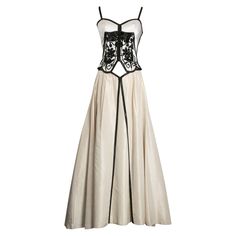 Azzaro - Bustier and skirt set in silk taffeta embroidered with pearly beads and black sequins. The skirt features a high waist and a white tulle petticoat. No composition or size tag, it fits a 36FR. Additional information: Dimensions: Bustier: Bust: 40 cm (15.74"), Waist: 33 cm (13"), Length: 49 cm (19.29") Skirt: Waist: 29 cm (11.41"), Length: 101 cm (39.76") Condition: Very good condition, with a few small stains Seller Ref number: FT161 Bustier And Skirt, Tulle Petticoat, Slim Aarons, Silk Taffeta, White Tulle, Bustiers, Emilio Pucci, Black Sequins, Petticoat