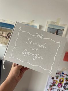 someone holding up a sign that says samuel and georgia