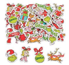 christmas stickers and decals are arranged on a white surface, with the words grin