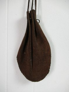 "Vintage 1980s leather and suede coin purse, cross body purse. Has long leather cinch strap. Included are the coins pictured(might save you a couple bucks!). Purse measures 9.5\" tall and 6.5\" wide. In very good condition." Vintage Leather Coin Purse With Removable Pouch, Vintage Handmade Brown Pouch, Handmade Brown Vintage Pouch, Vintage Leather Pouch Coin Purse, Vintage Handmade Leather Pouch, Handmade Vintage Leather Pouch, Handmade Vintage Coin Purse, Handmade Vintage Gold Coin Purse, Vintage Brown Pouch Coin Purse