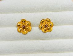 22k Gold Stud- Floral gold stud- Solid Gold Stud- Indian design Gold Stud- Ethnic Gold Stud- Everyday wear Gold Stud- 22 Gold earrings  These floral stud earrings are crafted from 22k Though simple in style, the flowers are beautifully designed with Indian floral culture that gives you sparkly and eye catchy look! Metal: 22k Gold  Marks: 22 k Stamped on the Findings  Weight: 3.40 gram Approx  Design: Floral Indian design Customer Satisfaction is our utmost priority, feel free to have any query, would love to hear from you . Jai Shree Shyam🙏🙏 Happy Shopping 🛍 Traditional Gold Flower-shaped Earrings, Traditional Yellow Gold Flower-shaped Earrings, Traditional Flower-shaped Earrings, 22k Gold Earrings, Shree Shyam, Floral Studs, Gold Stud, Indian Design, Design Floral