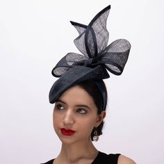 Dramatic bow adding height to the sinamay pillbox fascinator. This pillbox is with 2 inch up at back. Great fit for any indoor and outdoor event. One size with 1inch headband Material: 100% Sinamay Head Size: One Size Fit Most Brim size: 2 inch up Item Dimension: 7 x 9 1/2 inch Handmade Item. Origin: Made in Philippines Color on screen may vary from actual merchandise due to monitor restrictions or dye lots. Pillbox Fascinator, Monies Jewelry, Cotton Loungewear, Black Fascinator, Hair Bonnet, Outdoor Event, Pink Hat, Big Bow, Fascinator Hats