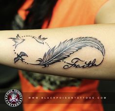 a woman's arm with a feather and the word faith tattooed on her forearm