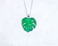 Monstera Tropical Leaf necklace. Green palm leaf pendant - good choice for summer, rest and having fun. This tropical necklace will be nice gift for her, especially if she's monstera leaf lover. Leaf are handmade from polymer clay, not fragile, not afraid of water, do not change color with time. READY TO SHIP 🍃 Dimensions: Size of leaf 1.38 * 1.38 inches (3.5 * 3.5 cm) The length of the chain to choose from when placing an order 🍃 Materials: - Polymer clay - Stainless steel (not darken) ❀ All Trendy Leaf-shaped Jewelry Gift, Trendy Green Leaf-shaped Jewelry, Handmade Green Leaf Necklace, Handmade Tropical Green Jewelry, Green Leaf-shaped Necklace For Gift, Tropical Necklace, Cute Polymer Clay, Necklace Green, Tropical Leaf