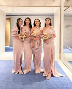 the bridesmaids are posing for a photo in front of an open - air lobby