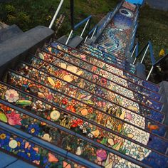 the stairs are decorated with stained glass flowers