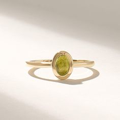 Introducing the exquisite Solid Gold Green Peridot Ring, a true masterpiece in the realm of fine jewelry. Handcrafted with utmost precision and attention to detail, this ring combines the timeless elegance of solid gold with the radiant allure of a bezel-set solitaire gemstone. Features * Gold KT: 10K, 14K, 18K * Custom Gold Color: Rose Gold, Yellow Gold, White Gold * Top of Band: 8.00x6.60MM * Width of Band: 1.50MM * Thickness of Band: 1.30MM * Main Gemstone: Natural Peridot * Total Ctw: 0.50 Ctw * Ready to Ship in 5-7 Business Days ✓ We care about the environment,the jewelry we cast is made with recycled gold. We source exclusively post-consumer material that is refined back to their pure elements to ensure that the gold is in the same quality. Our designs are made from 14k/18k/10k real Luxury Oval Peridot Rings, Elegant Peridot Gemstone Stackable Rings, Elegant Peridot Stackable Rings For May Birthstone, Fine Jewelry Peridot Rings For May Birthstone, Yellow Gold Peridot Diamond Ring With Birthstone, Yellow Gold Round Tourmaline Jewelry, Heirloom Gold Tourmaline Ring, Yellow Gold Peridot Stackable Rings For Anniversary, Elegant Yellow Gold Tourmaline Birthstone Ring