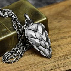 Material: 925 silver, brass Size: 19mm*46mm (thick) Weight: Brass: about 23g                  Silver: about 27g ◆This is a handmade dragon scale urn pendant. Each item is custom made and has a special meaning to you. How special your loved ones are to you and how sad it is when they leave us. This necklace includes a hollow urn pendant to hold the cremated ashes of your loved one for long-lasting remembrance and companionship. ◆Unscrew the screw cap of the round ring at the top, fill it with ash Urn Pendant, Urn Jewelry, Women Pendant, Urn Necklaces, Dragon Scale, Cremation Jewelry, Round Rings, Memorial Jewelry, Simple Jewelry