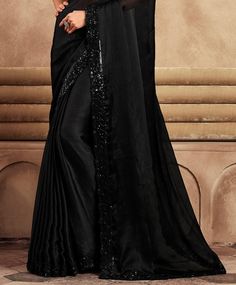 COLOR : Black FABRIC : Saree - Chiffon, Blouse - Chiffon & Net WORK : Resham Embroidery, Stones, Sequins, Lace BorderOCCASION : Wedding, Engagement, Party Wear, Festival, Sangeet NOTE : The outfit includes blouse and saree only. Petticoat is not included. READY-TO-WEAR : No STITCHING : Available as semi-stitched fabric, can be stitched using standard size option (+$30). Note: There might be a slight color variation due to lighting and flash used during photoshoot. The bright shade seen is the best closer view of fabric's color. Black Partywear Saree, Formal Blouse Piece With Resham Embroidery In Georgette, Formal Embroidered Art Silk Saree, Fitted Chiffon Traditional Wear For Wedding, Formal Georgette Saree With Intricate Embroidery, Formal Georgette Fabric With Zari Embroidery, Black Silk Dupatta For Wedding, Formal Black Georgette Traditional Wear, Fitted Black Silk Saree