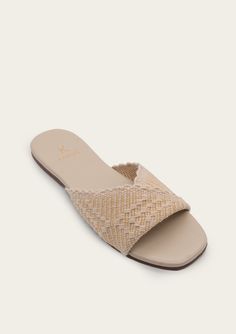 Upper: 100% Cotton Inner Sole: Leather Sole: Rubber Fit Comments: True to size Half sizes should size up if regular-width or size down if narrow width Paige Handwoven twisted Slide Sandal Vacation Slippers With Textured Sole And Round Toe, Beige Slip-on Sandals With Textured Sole, Beige Leather Slippers For Vacation, Beige Synthetic Slippers With Removable Insole, Comfortable Beige Slippers With Woven Sole, Vacation Flat Slippers With Textured Sole, Casual Flat Slippers With Woven Sole, Beige Textured Footbed Slippers For Vacation, Beige Slippers With Removable Insole For Vacation