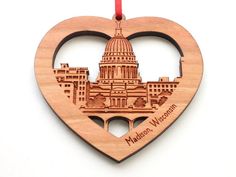 a wooden ornament shaped like a heart with the capital building in washington d c