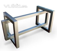 a metal table that is on display with the words vukkas above it and below it