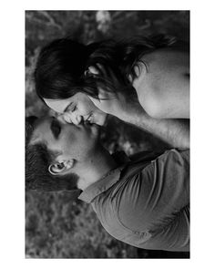 black and white photograph of two people talking on cell phones