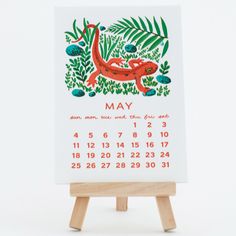 a calendar with an image of a lizard on it