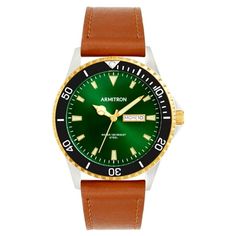 With a gold two-tone round case, this timepiece showcases a striking green dial paired with a brown leather band and secured by a classic buckle closure. With a 50-meter water-resistant design, UP indexes, and a calendar displaying day and date functions, this watch effortlessly combines style and functionality. Embrace sophistication with this elegant accessory, boasting precise analog movement from Japan. Size: one size.  Gender: male.  Age Group: adult. Formal Green Chronograph Analog Watch, Formal Green Analog Chronograph Watch, Formal Green Chronograph Watch, Green Chronograph Watch With Analog Display For Business, Business Chronograph Watch With Green Analog Display, Business Green Chronograph Watch With Analog Display, Green Leather Watches With Subdials, Green Automatic Chronograph Watch For Business, Green Leather Chronograph Watch