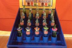 an assortment of beer bottles sitting in a blue cooler