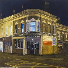 a painting of an old building on the corner of a city street at night time